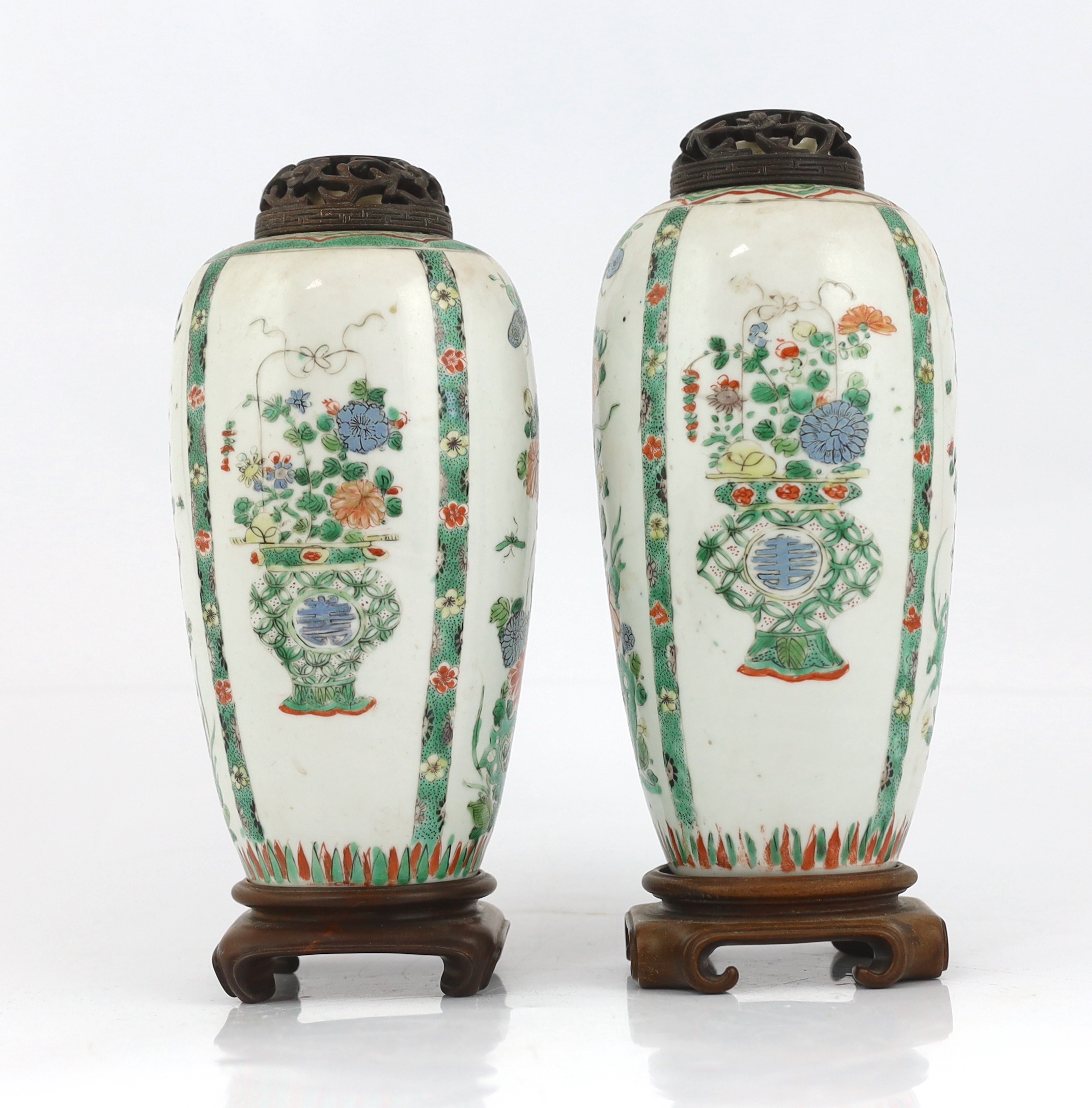 A near pair of Chinese famille verte jars, Kangxi period, on wood plinths, blue enamels repainted